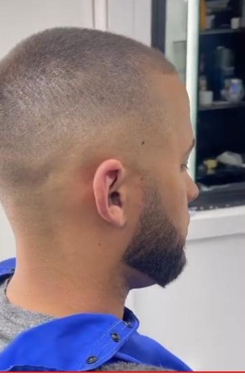Skin fade and sculpted beard line-up at Unlimited Barbershop